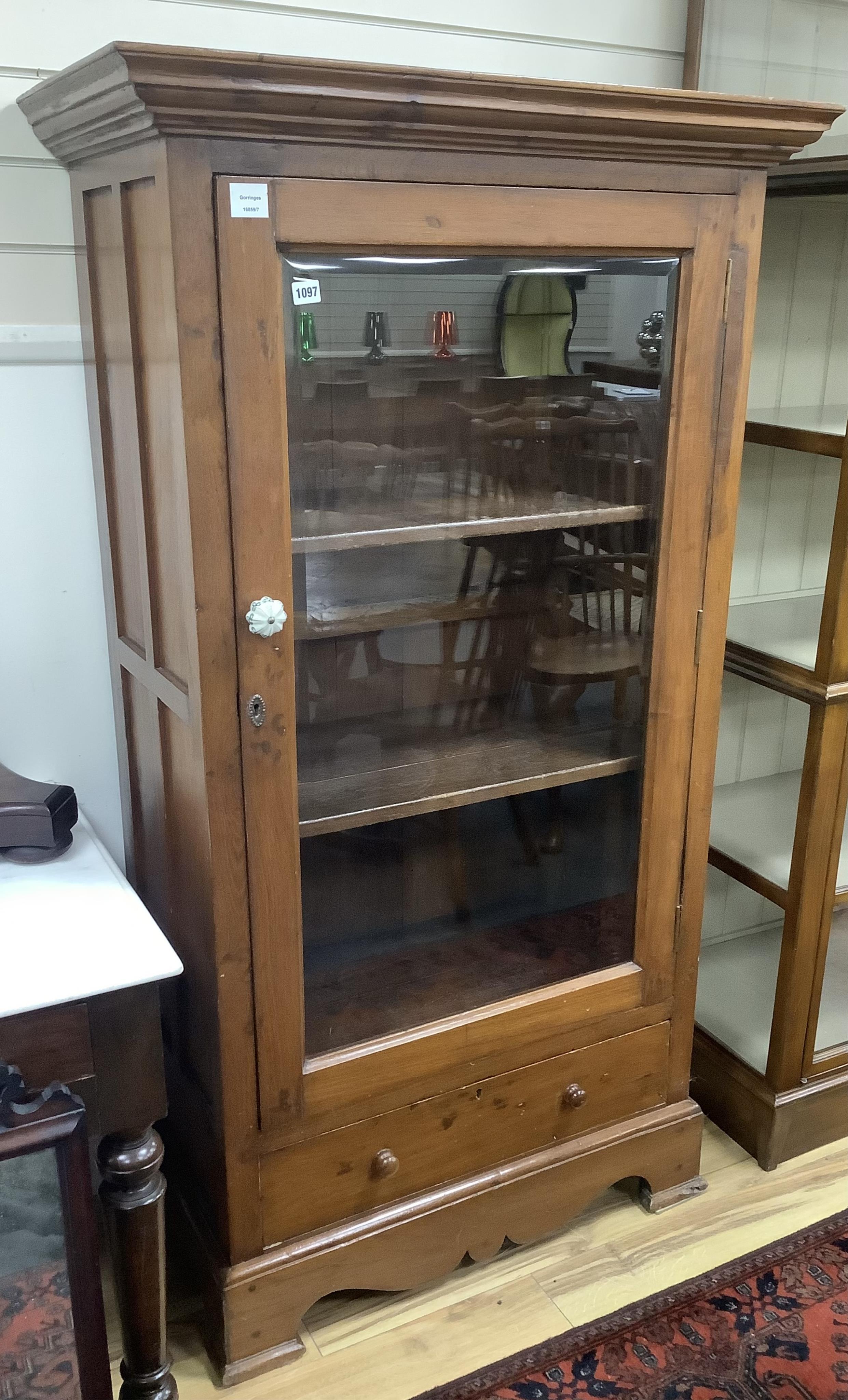 A Louis Philippe style Anglo Indian teak vitrine, with lower drawer, width 89cm, depth 48cm, height 168cm. Condition - fair to good